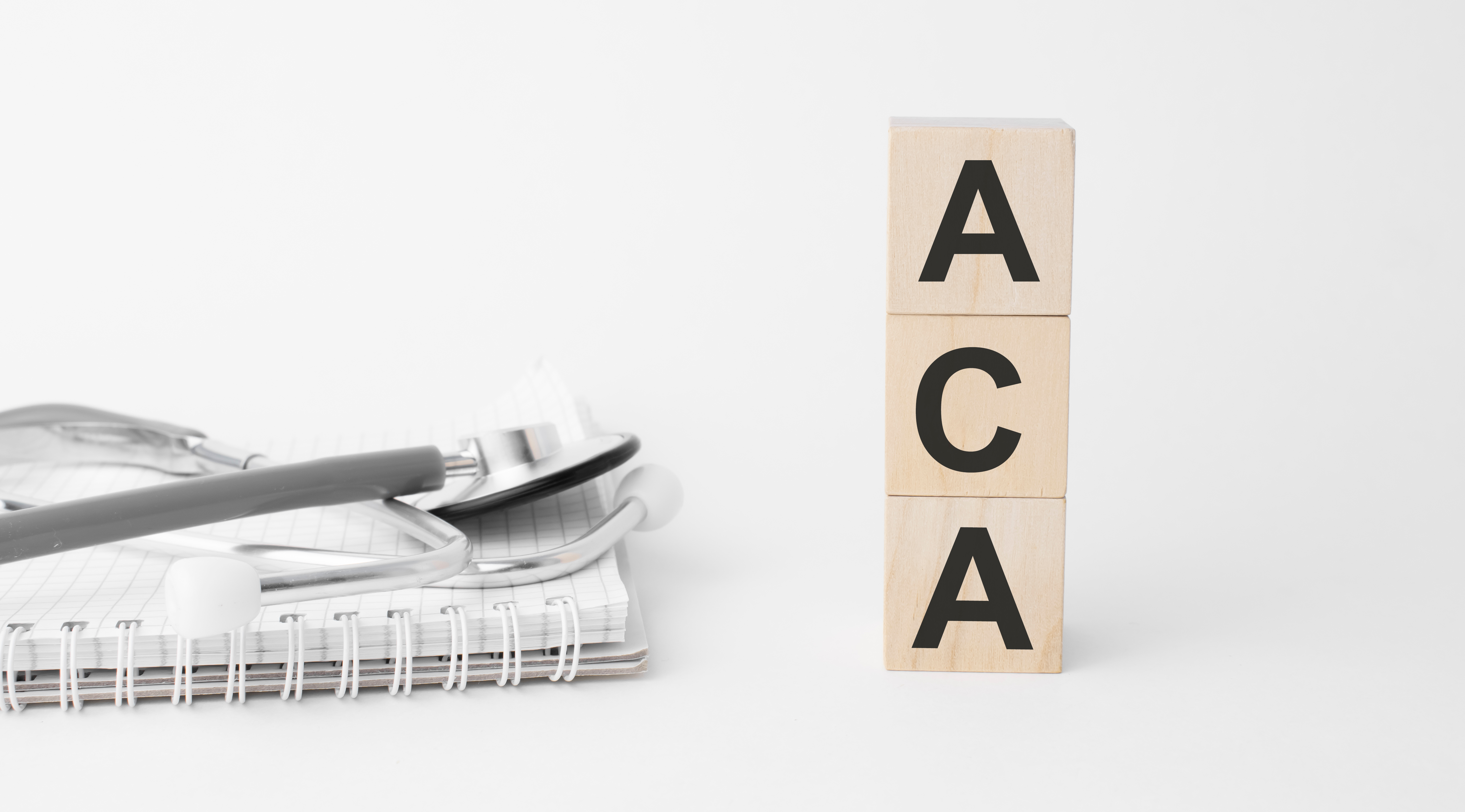 ACA written on wooden blocks