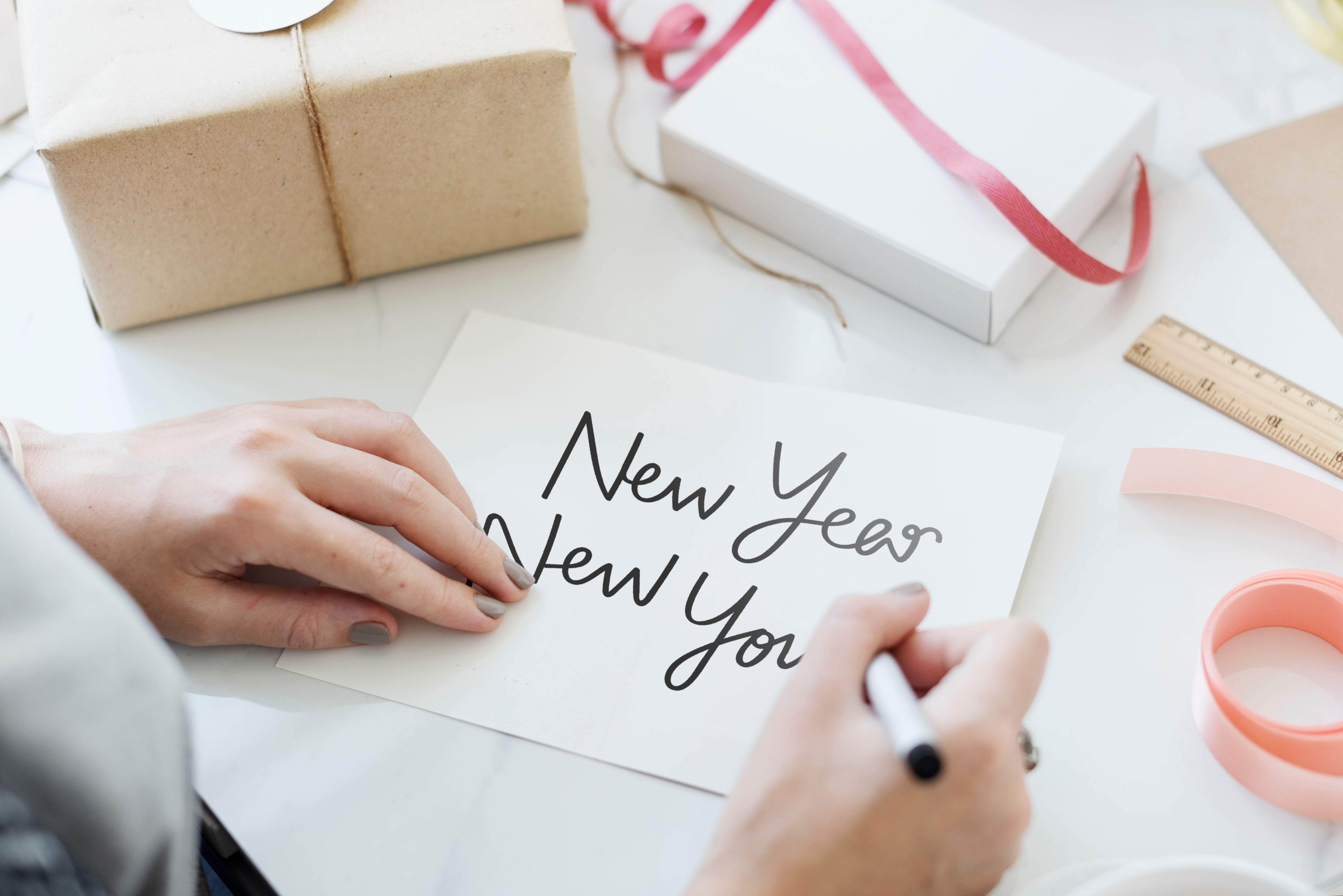 Hand writing New Year New You on white card